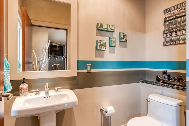 bathroom featuring sink and toilet