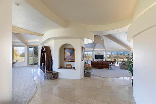 hallway with lofted ceiling with beams