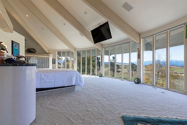 unfurnished bedroom featuring beam ceiling, carpet, and high vaulted ceiling