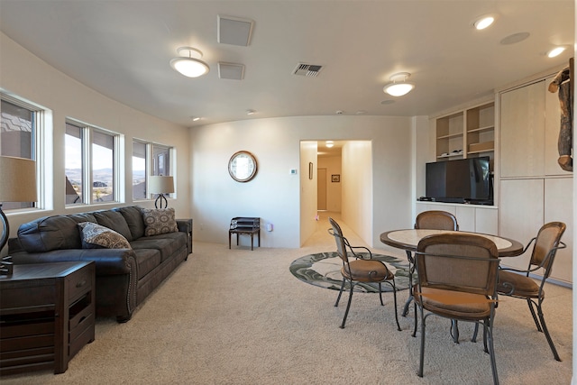 carpeted living room featuring built in features