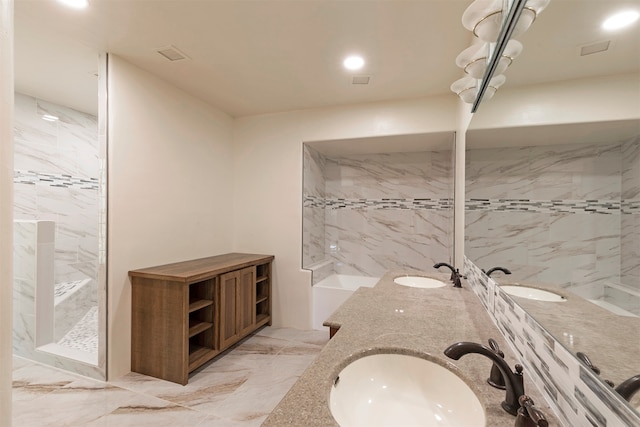 bathroom featuring vanity and tiled shower