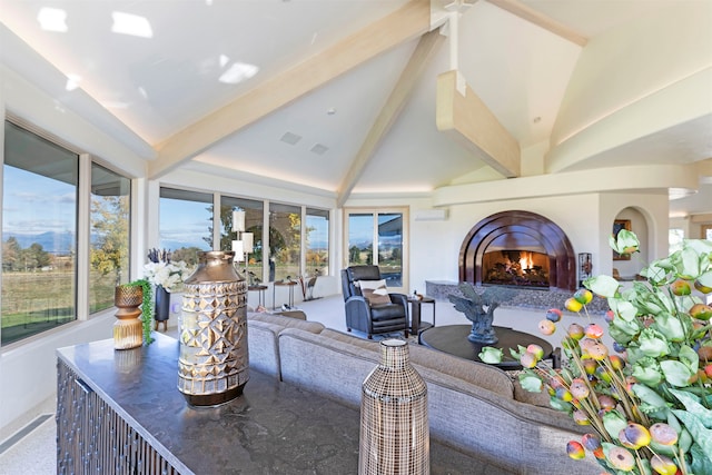 interior space featuring beam ceiling and high vaulted ceiling