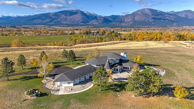 birds eye view of property with a mountain view and a rural view