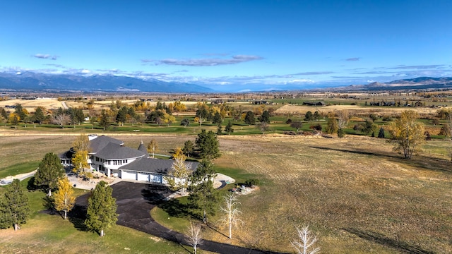 bird's eye view with a mountain view and a rural view