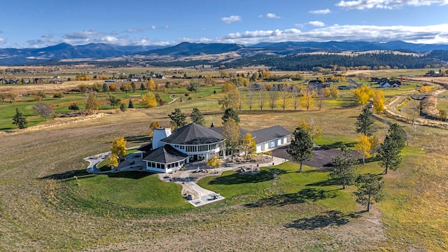 aerial view with a mountain view and a rural view