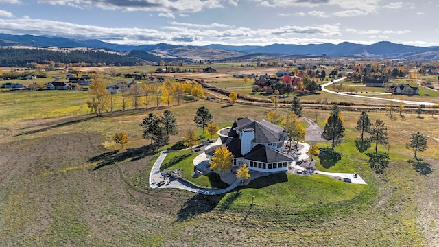 birds eye view of property with a mountain view and a rural view