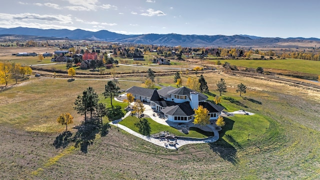 drone / aerial view featuring a rural view and a mountain view