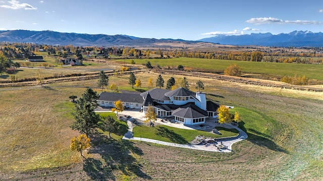 drone / aerial view with a mountain view and a rural view