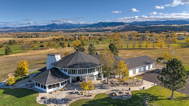 aerial view with a mountain view and a rural view