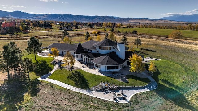 aerial view with a mountain view and a rural view