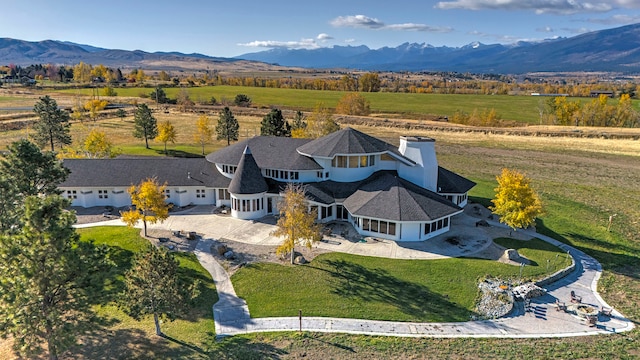 birds eye view of property featuring a rural view and a mountain view