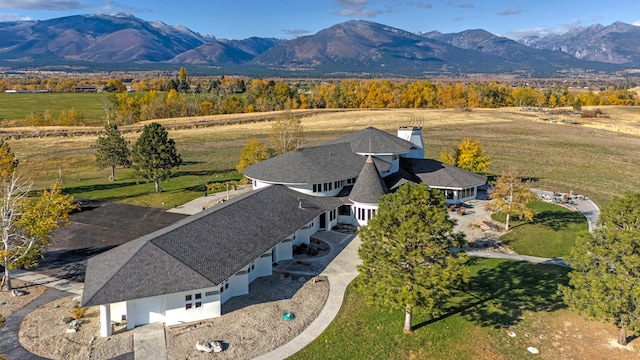 birds eye view of property featuring a mountain view