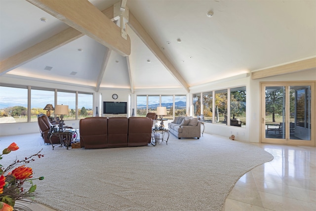 tiled living room with beamed ceiling and high vaulted ceiling