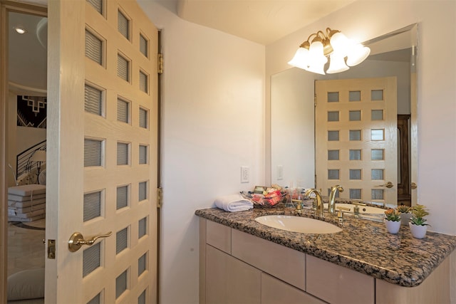 bathroom featuring vanity and an inviting chandelier