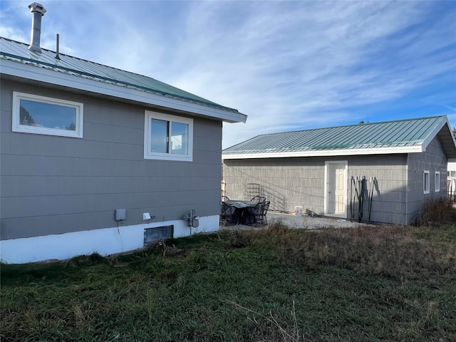 view of side of property with a yard