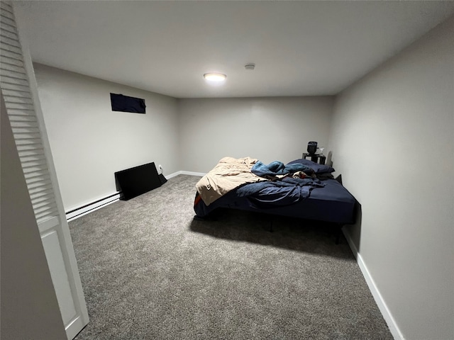 715 Texas Ave, Deer Lodge, MT 59722 - carpeted bedroom featuring a baseboard heating unit and baseboards