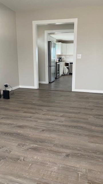 715 Texas Ave, Deer Lodge, MT 59722 - spare room featuring dark wood-style flooring