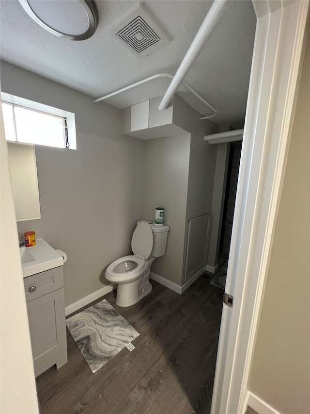 715 Texas Ave, Deer Lodge, MT 59722 - bathroom featuring vanity and wood finished floors