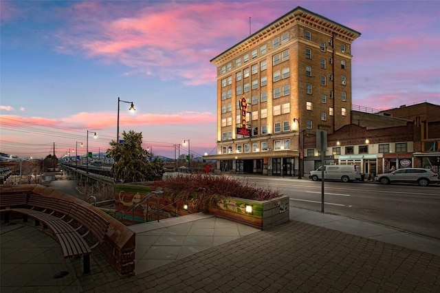 view of outdoor building at dusk