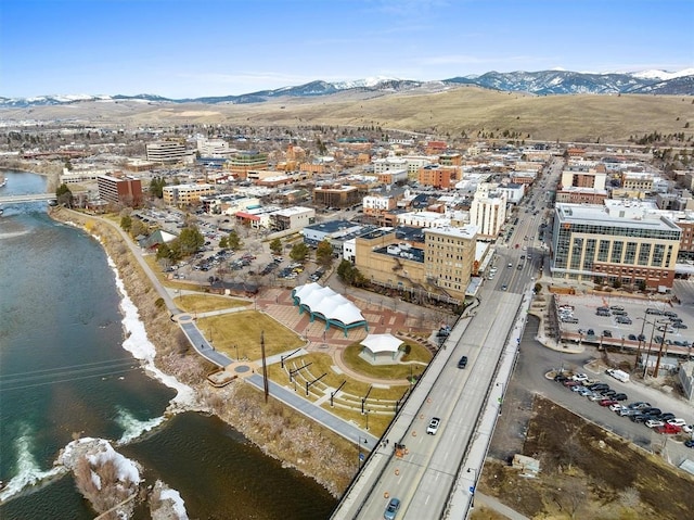 drone / aerial view with a water and mountain view