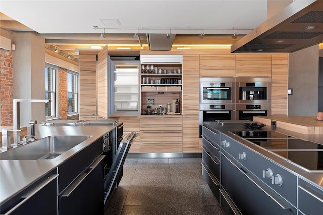 kitchen featuring sink, range hood, stainless steel appliances, stainless steel counters, and light brown cabinets