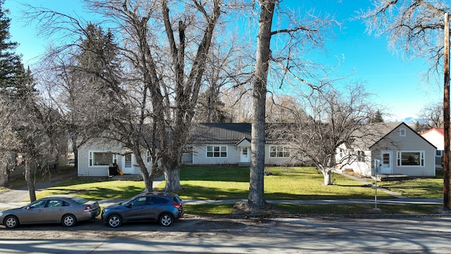 ranch-style house with a front lawn