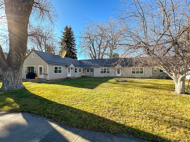 ranch-style home with a front lawn