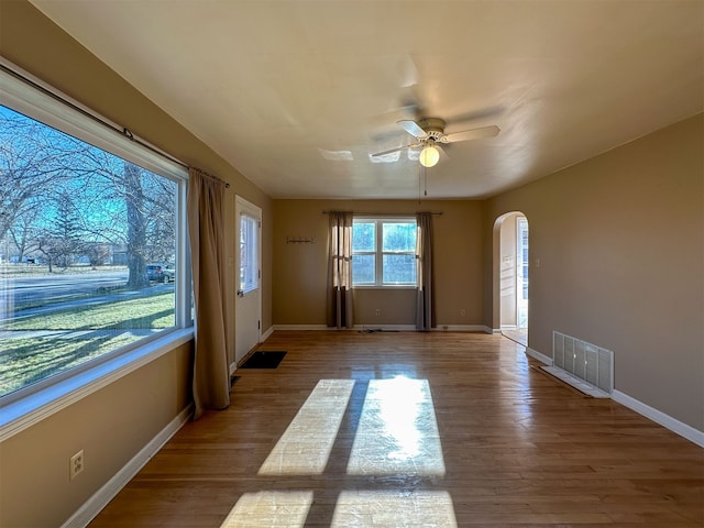 unfurnished room featuring ceiling fan and light wood-type flooring