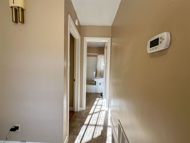 hall featuring light tile floors