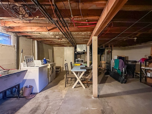 basement featuring sink and washing machine and dryer