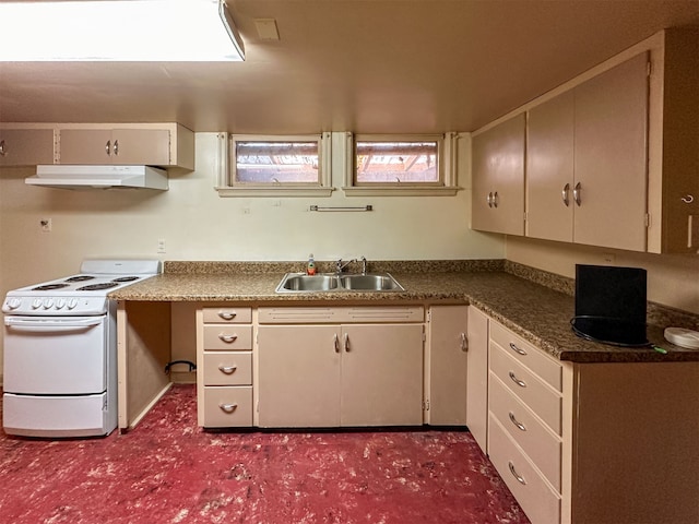 kitchen with white gas range oven and sink