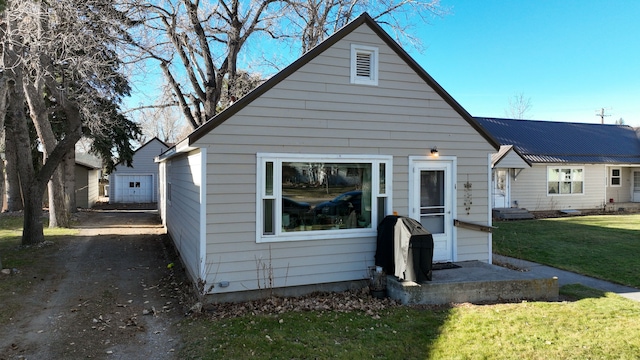 exterior space with a lawn and a garage