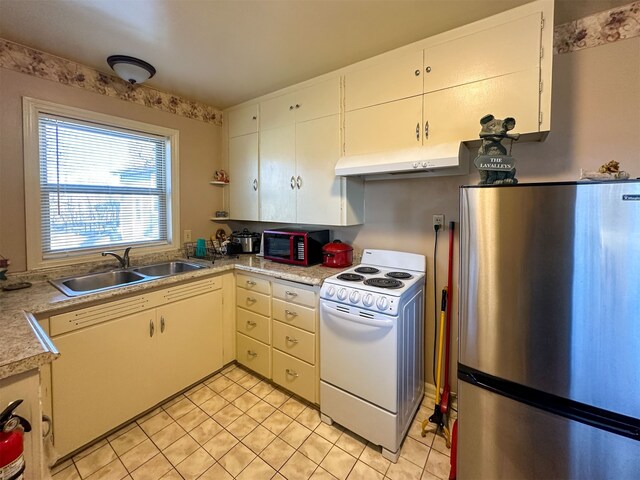 kitchen with stainless steel fridge, white cabinets, sink, and white electric range