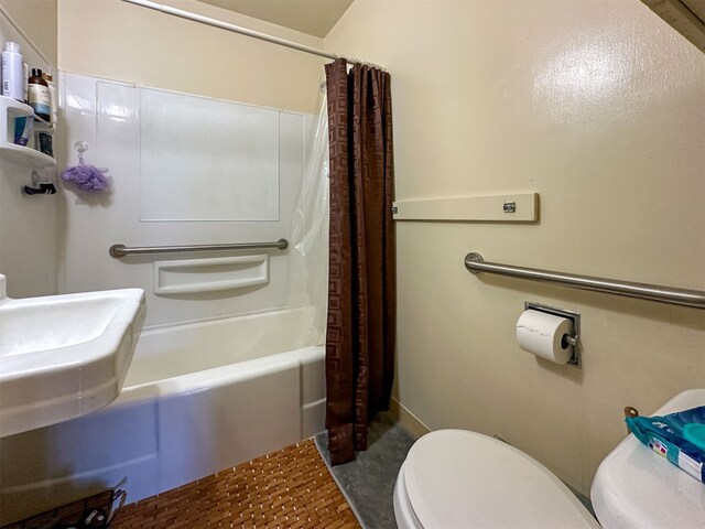 bathroom featuring shower / bath combination with curtain, toilet, and tile floors