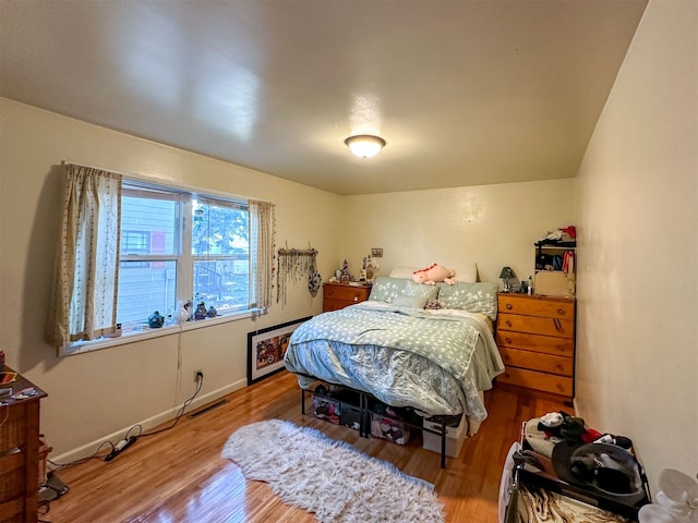 bedroom featuring wood-type flooring