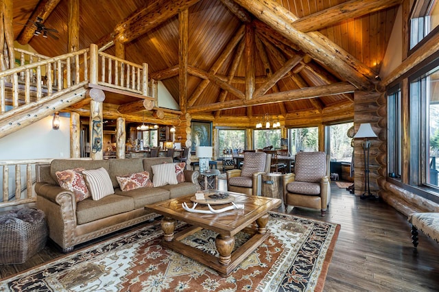 living area featuring high vaulted ceiling, wood ceiling, rustic walls, and beamed ceiling