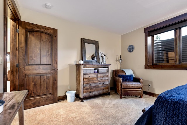 carpeted bedroom with baseboards