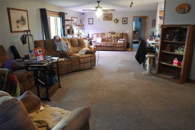 living room with ceiling fan and light carpet