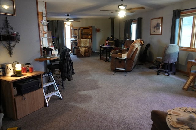 carpeted living room with ceiling fan