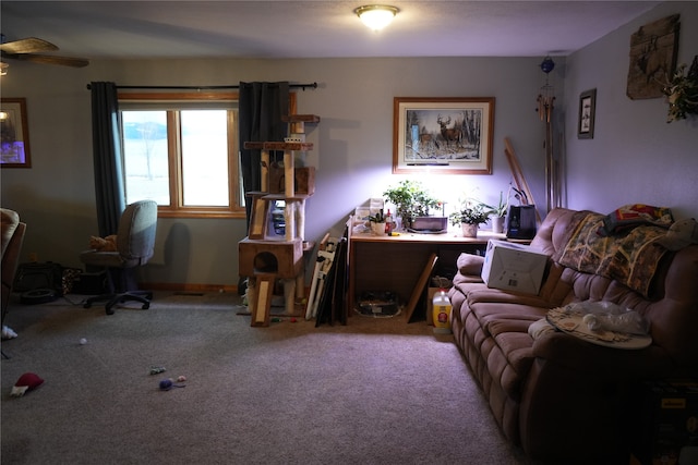 living room with ceiling fan and carpet flooring