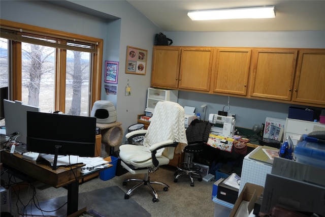 home office with carpet flooring and lofted ceiling