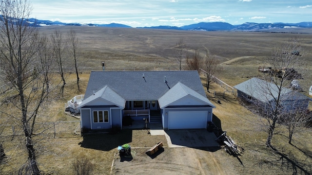 birds eye view of property with a mountain view