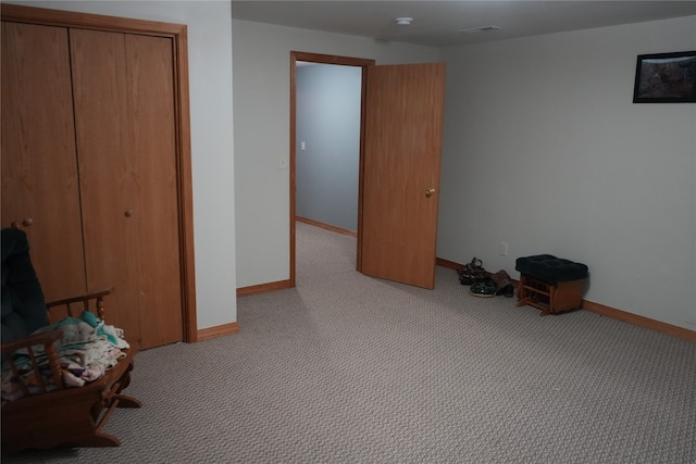 unfurnished room with light carpet