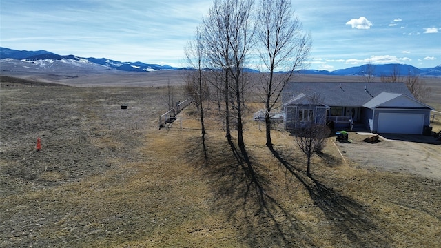 mountain view featuring a rural view