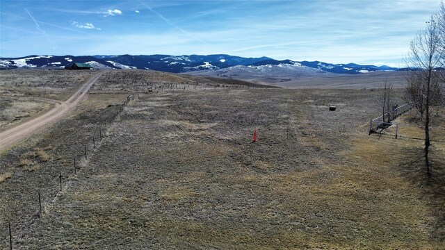 exterior space with a rural view and a mountain view