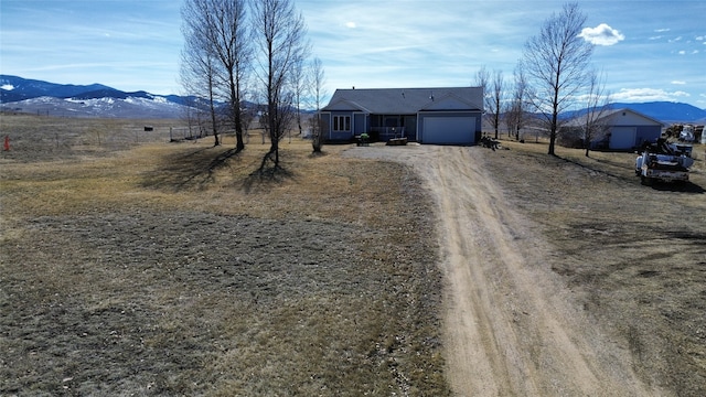 view of road featuring a mountain view and a rural view