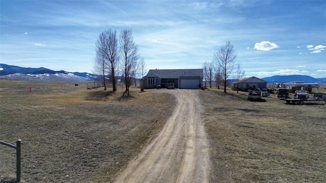 view of road with a mountain view and a rural view