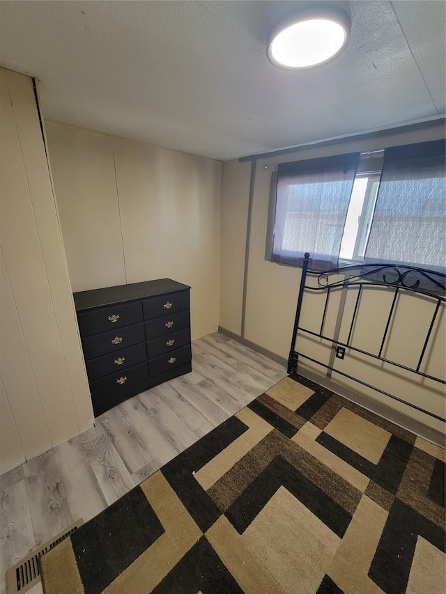 unfurnished bedroom with light hardwood / wood-style floors