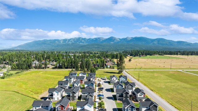 birds eye view of property with a mountain view