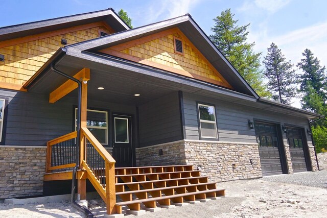 view of front of home with a porch and a garage